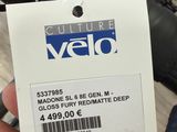 a person holding a card that says velo on it