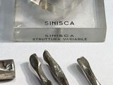 a display case with a bunch of silver objects on it