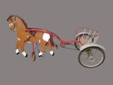 un cheval en jouet tirant une calèche sur laquelle est posé un panier