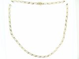 a gold chain that is attached to a white shirt