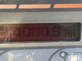 a close up of a clock on the side of a parking meter