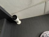 an image of a security camera mounted on a wall