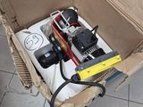 a box full of assorted items sitting on the floor