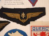 several different types of military patches are displayed on a piece of paper