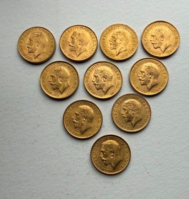 several gold coins are arranged in the shape of a heart
