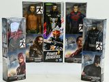 five action figures of the justice league in the box