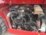 a red truck with a red engine and a yellow box in the back