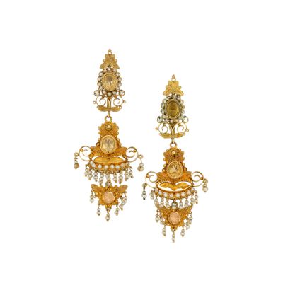 an image of a pair of earrings with gold and pink stones