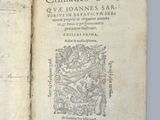 un livre ouvert sur lequel est dessiné un dragon