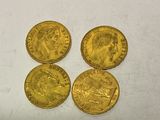 four gold sovereigns, one of which is a sovereign and the other of which is a sovereign