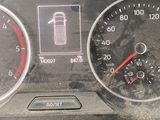a close up of a car dashboard with various gauges