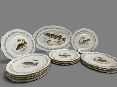 six plates with fish designs on them sitting on top of each other