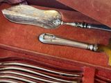 a case with silverware inside of it on a table