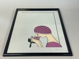 a framed picture of a woman with a bird in her hand