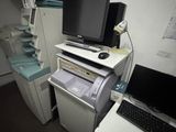 a desk with a computer and a printer on it