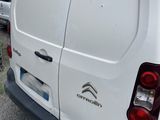 a white van that is parked in a lot