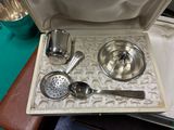 a silver tray with a set of utensils on it