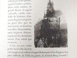 a black and white photo of a castle with a clock tower
