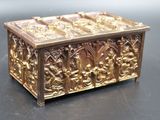 a gold box that is sitting on a table