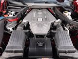 the engine of a car with its hood open and the hood down