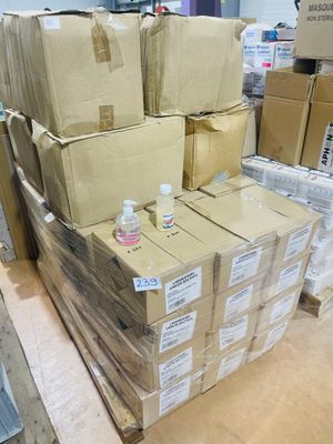 many boxes stacked on top of each other in a warehouse