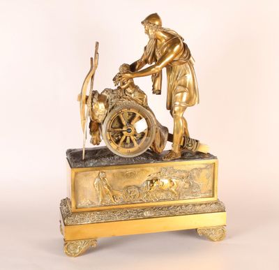 une image représentant une statue en bronze d'un homme avec une roue et un chien