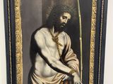 painting of a man with a sword in a frame on a wall