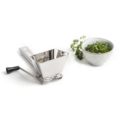 a small bowl of parsley and a small bowl of parsley on a white surface
