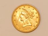 an image of a gold coin with a woman ' s head on it