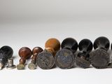 a lot of different types of knobs on the table