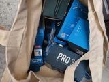 a bag full of cell phones sitting on the floor
