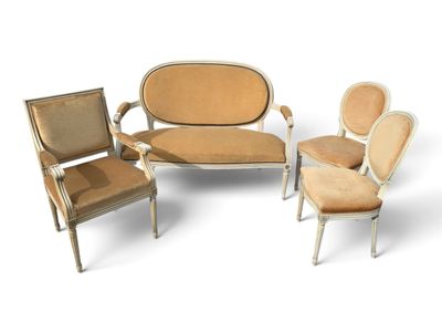 a group of chairs and a couch sitting next to each other