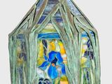 an image of a stained glass lamp hanging from a ceiling