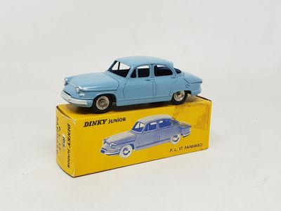 a blue toy car sitting on top of a yellow box