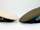 two hats sitting next to each other on a table