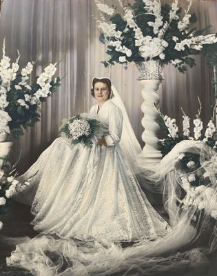 an old photo of a woman in a wedding dress