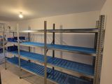 a room that has a bunch of shelves in it