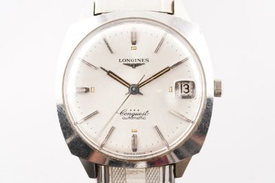 an image of a longines watch with a white dial and a silver bracelet