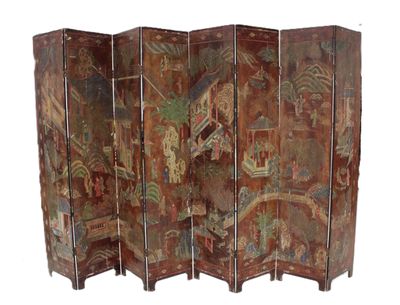 a close up of a room divider with a painting on it