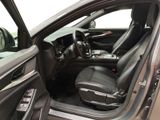 the interior of a car with the door open and the driver ' s seat up