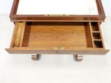 a wooden box with a mirror on top of it