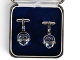 pair of silver cufflinks in a box with a white ribbon