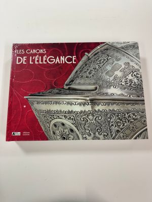 an image of a book with a picture of a silver box on it