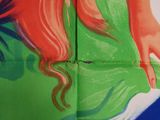 a picture of a woman with long red hair on a green and blue background
