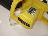 a yellow cord saw sitting on top of a table
