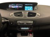 the interior of a car with a steering wheel, dashboard, and display screen