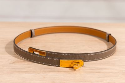 a close up of a belt on a wooden surface