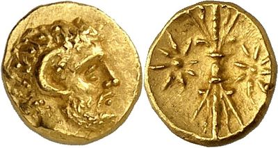 a gold coin with an image of a woman on it