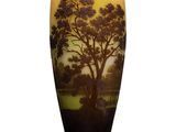 a vase that has a picture of a tree on it