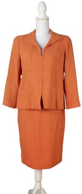 an orange skirt suit on a mannequin mannequin mannequin mannequin mannequin mannequin mannequin mannequin manne